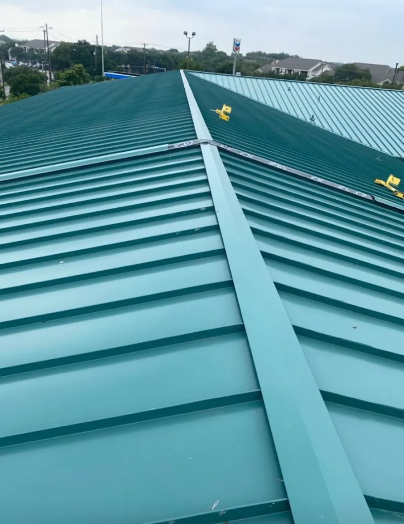 Green commercial metal roof ridge and valley for Metal Roof Repair in Richmond Heights